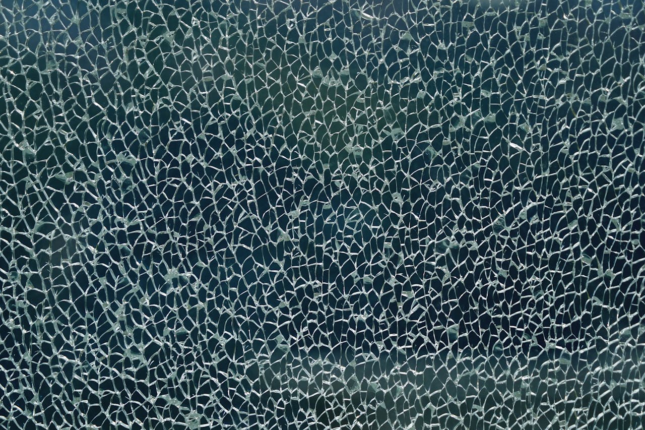 Crafting Captivating Headlines: Your awesome post title goes here Close-up of shattered glass forming an intricate web-like pattern, showcasing unique texture and abstract forms.